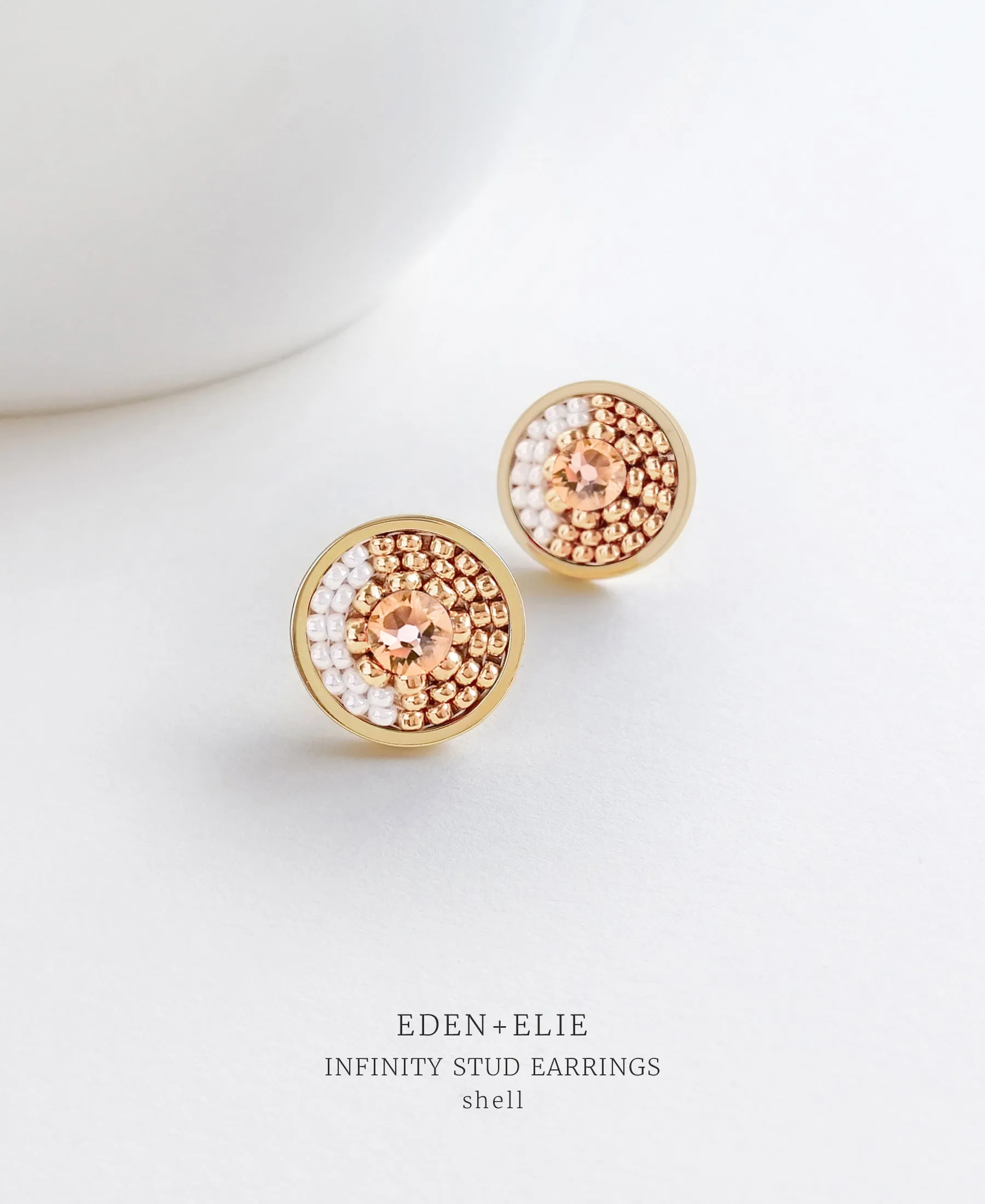 EDEN   ELIE Infinity stud earrings - shell